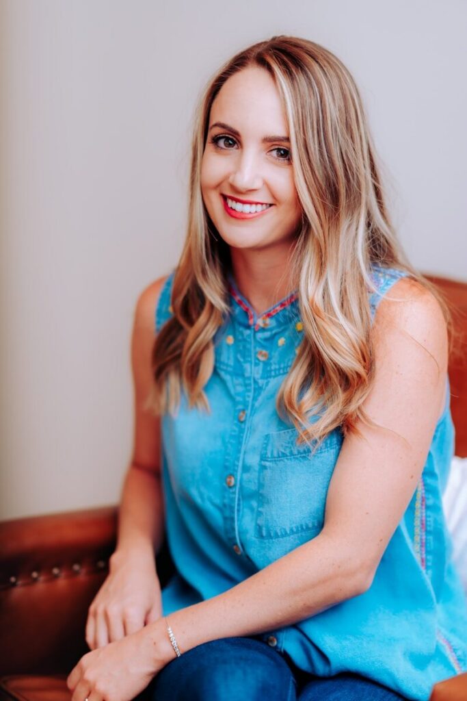 smiling girl in blue sleeveless dress